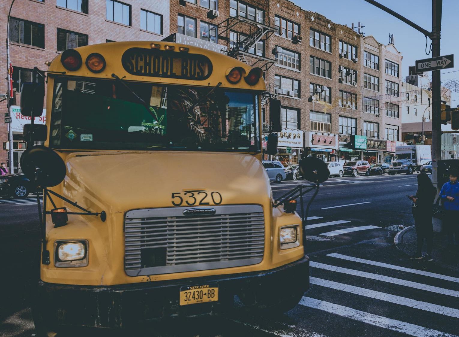 yellow bus on street
